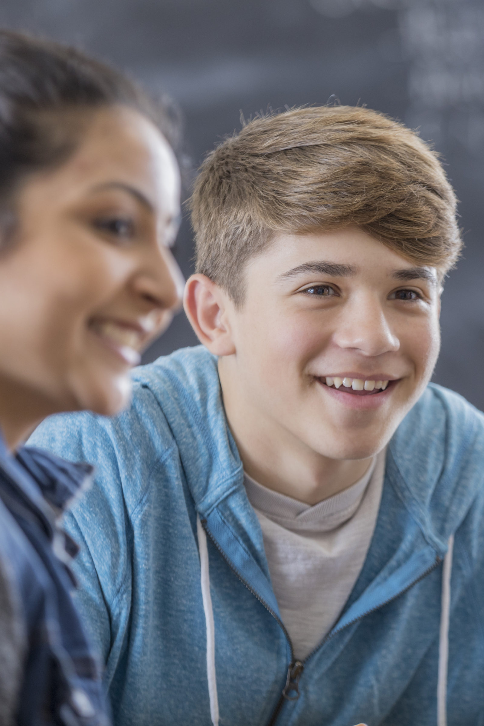 Attentive teenage boy leads study group